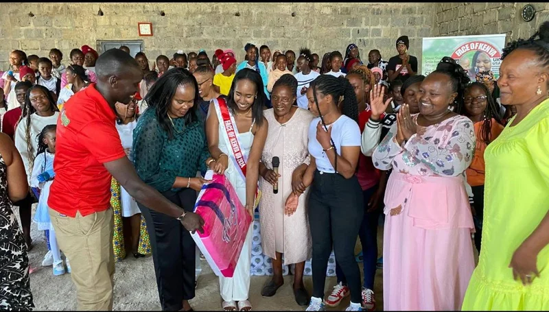 Sanitary towel distribution ceremony with young girls receiving essential hygiene supplies