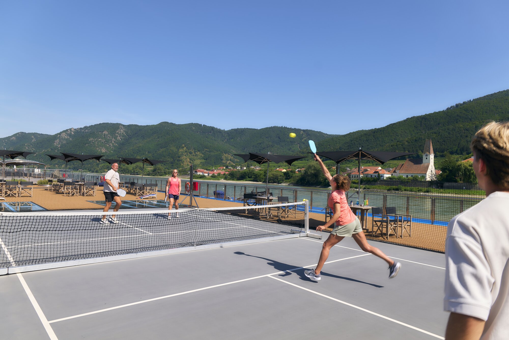 Guests playing pickleball in action on the AmaMagna sundeck on the Danube in Germany