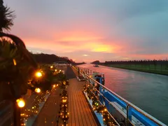 View of the AmaMagna sun deck with Christmas decorations during sunset