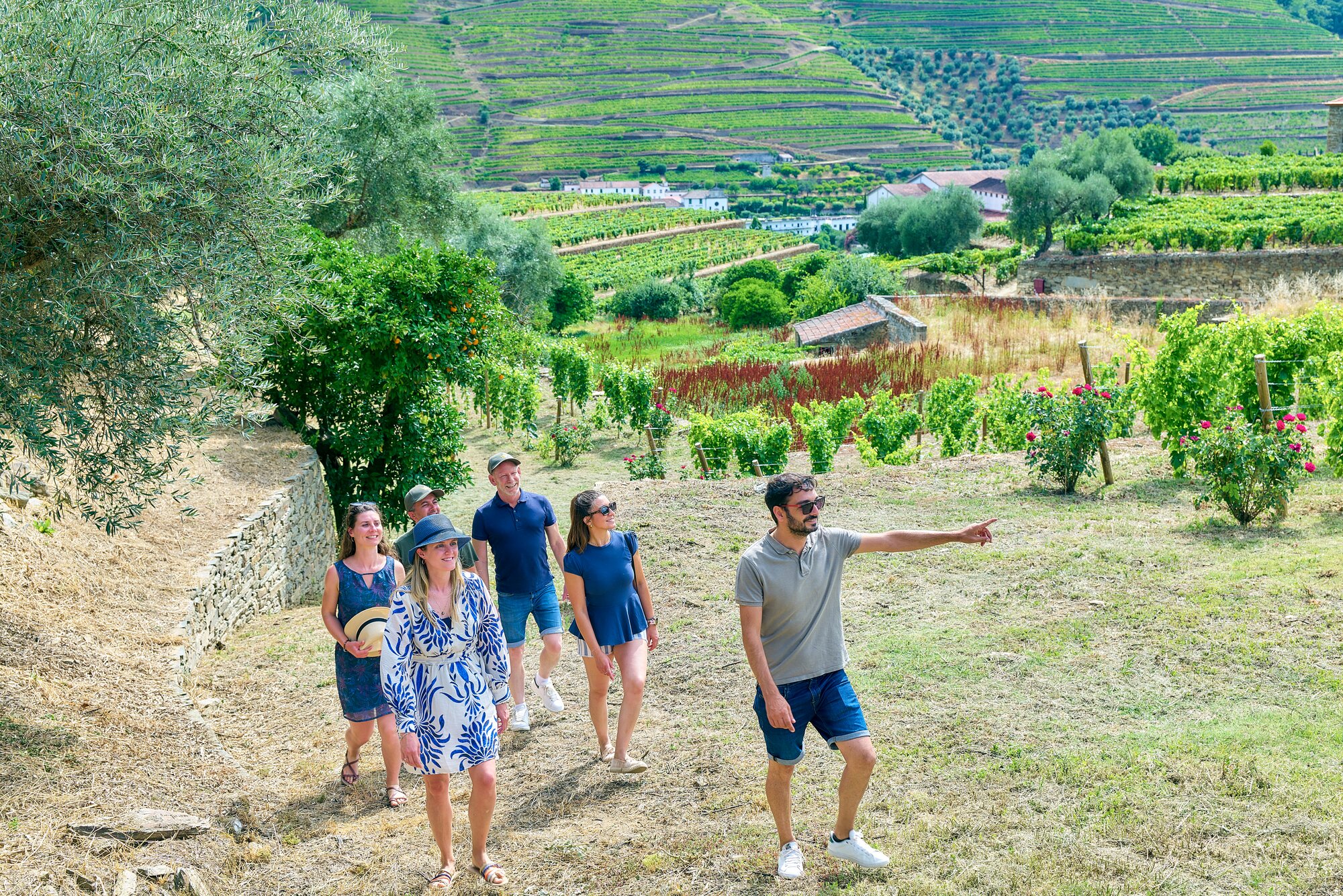 Guests hiking the Quinta da Roêda vineyard in Pinhao, Portugal