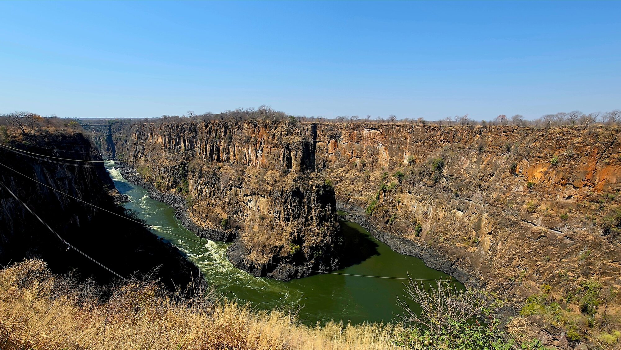 The dramatic Zambezi Gorge below Victoria Falls, showing the rocky cliffs and the rushing river.