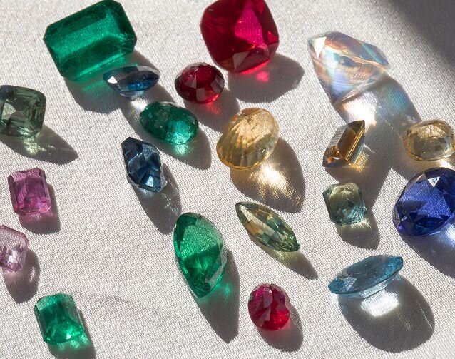 Loose coloured gemstones in emerald, ruby, sapphire and yellow stones