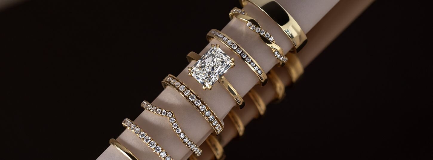 Gold diamond rings stacked with radiant cut engagement ring
