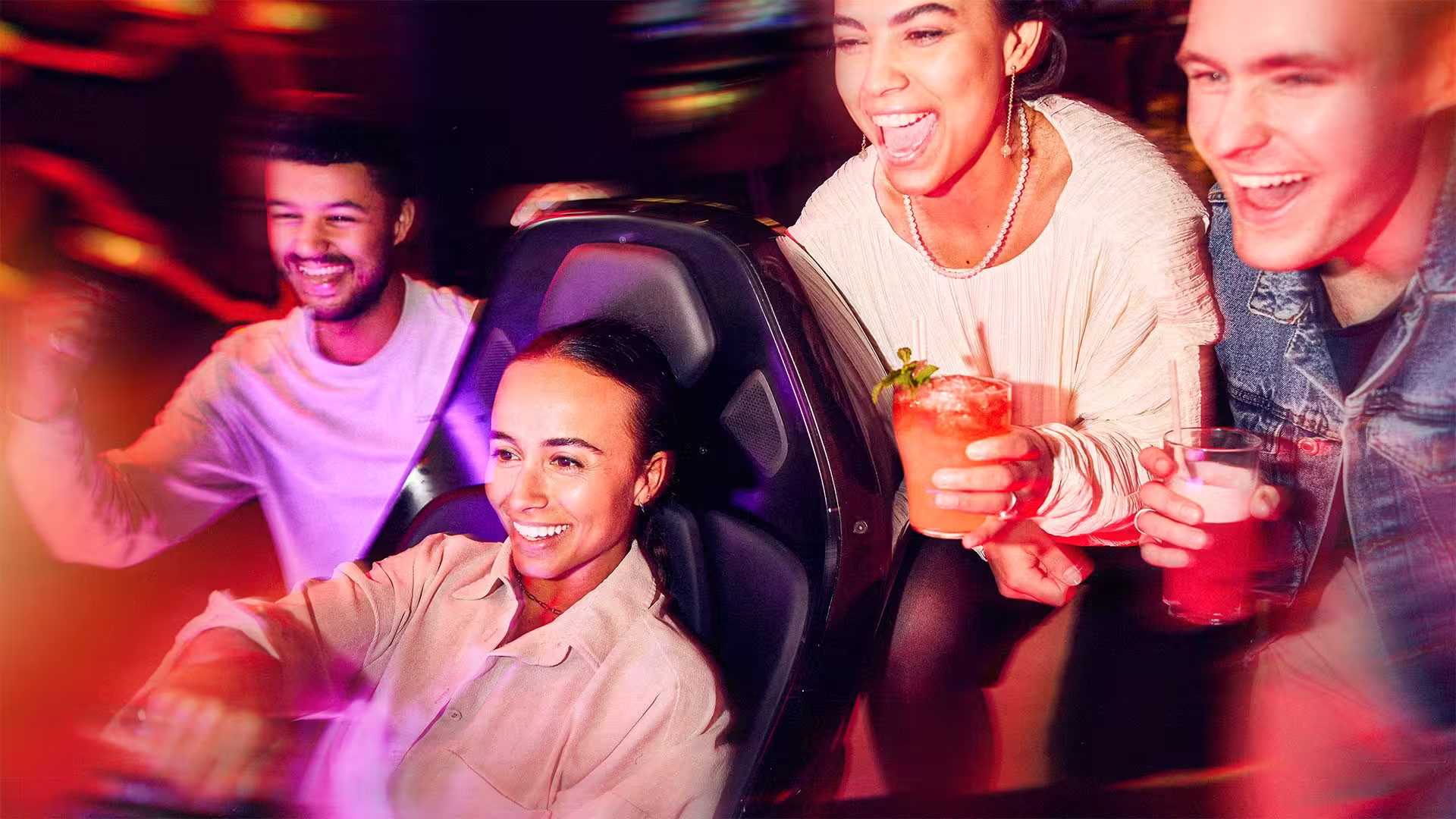 Group enjoying racing at F1 Arcade