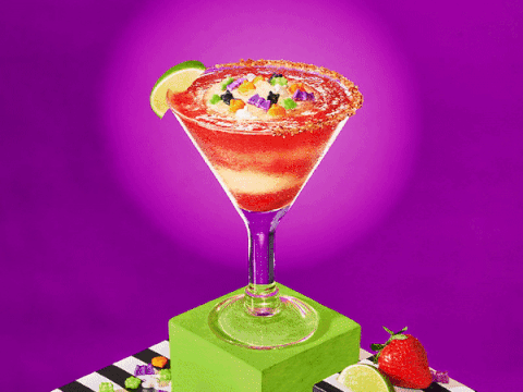 Chili's October Trick or Treat-A-Rita on a green pedestal with a purple vortex background