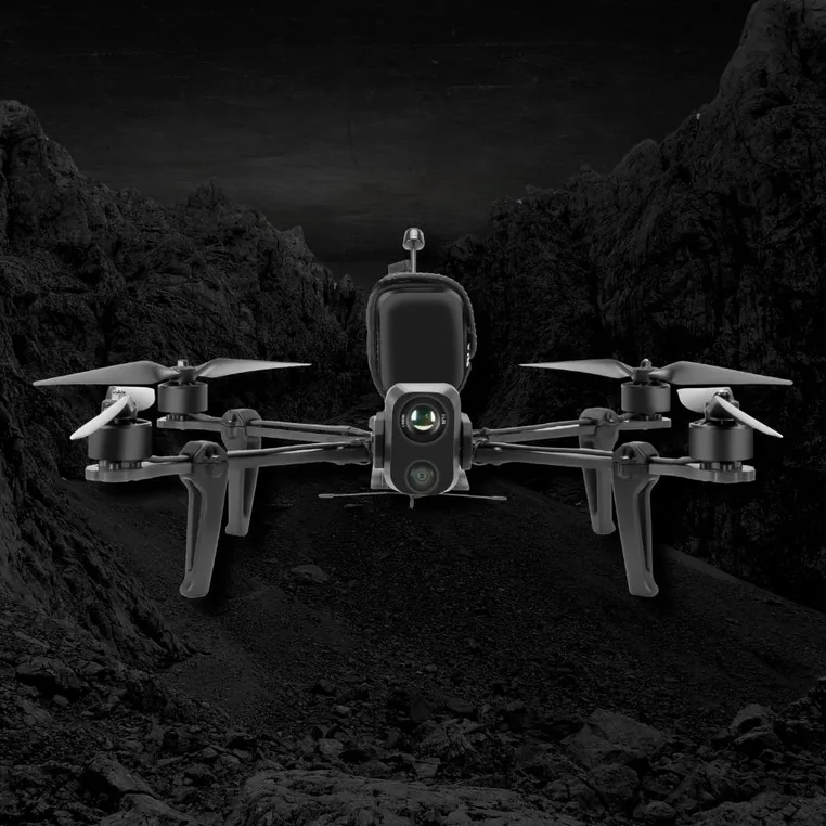 Lumenier NightHawk AttriX ISR drone in a rugged landscape.