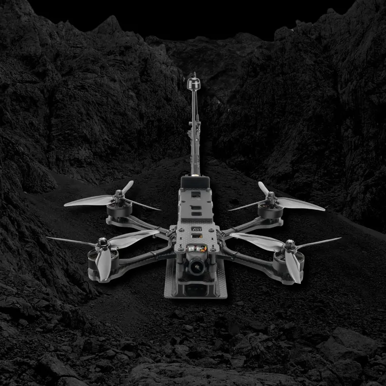 Lumenier NightHawk AttriX5 drone in a rugged landscape.