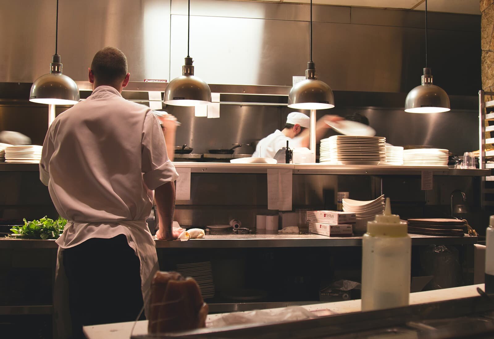 Restaurant workers busy in the kitchen