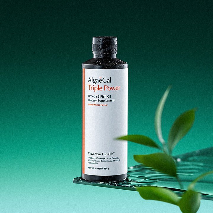 Bottle of AlgaeCal Triple Power and a leaf in the foreground