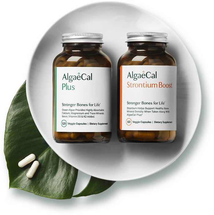 One bottle each of AlgaeCal Plus and Strontium Boost on a white plate