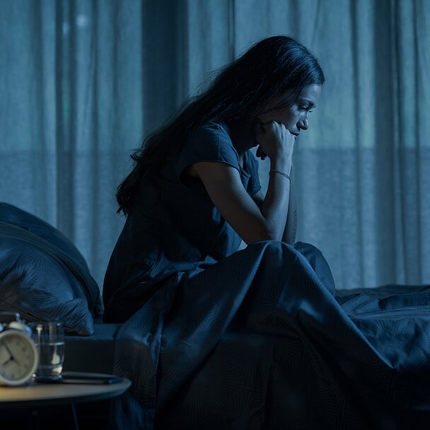 Woman sitting in the bed