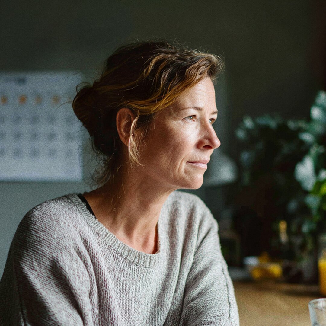 Woman looking out a window