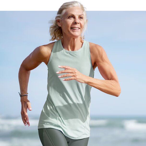 Dr. Larry May wearing a lab coat and writing