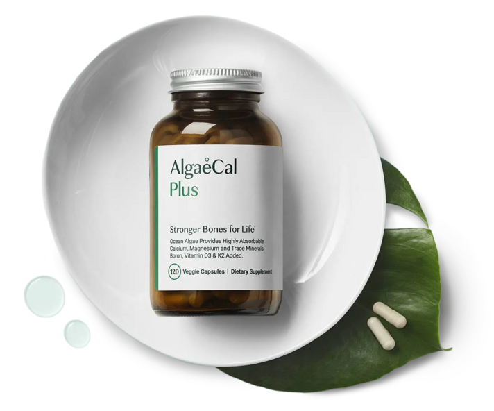 AlgaeCal Plus bottle on a white plate