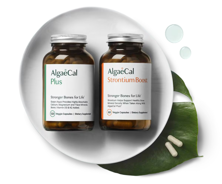 One bottle AlgaeCal Plus and one bottle AlgaeCal Strontium boost on a white plate