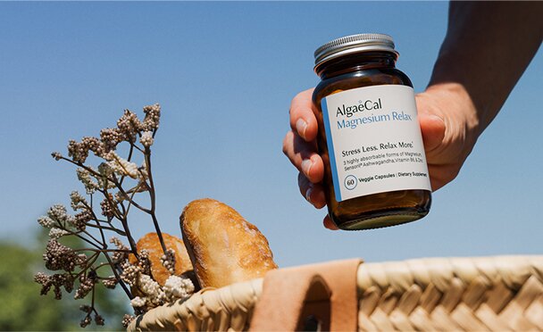 AlgaeCal Magnesium Relax™ Bottle above a picnic basket