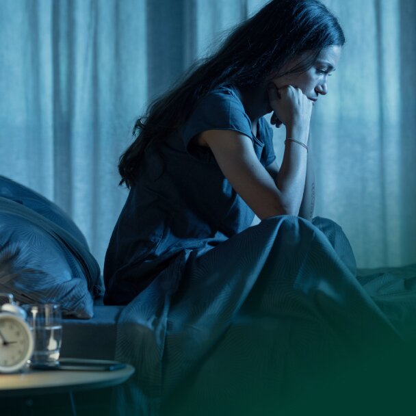 Woman sitting in the bed