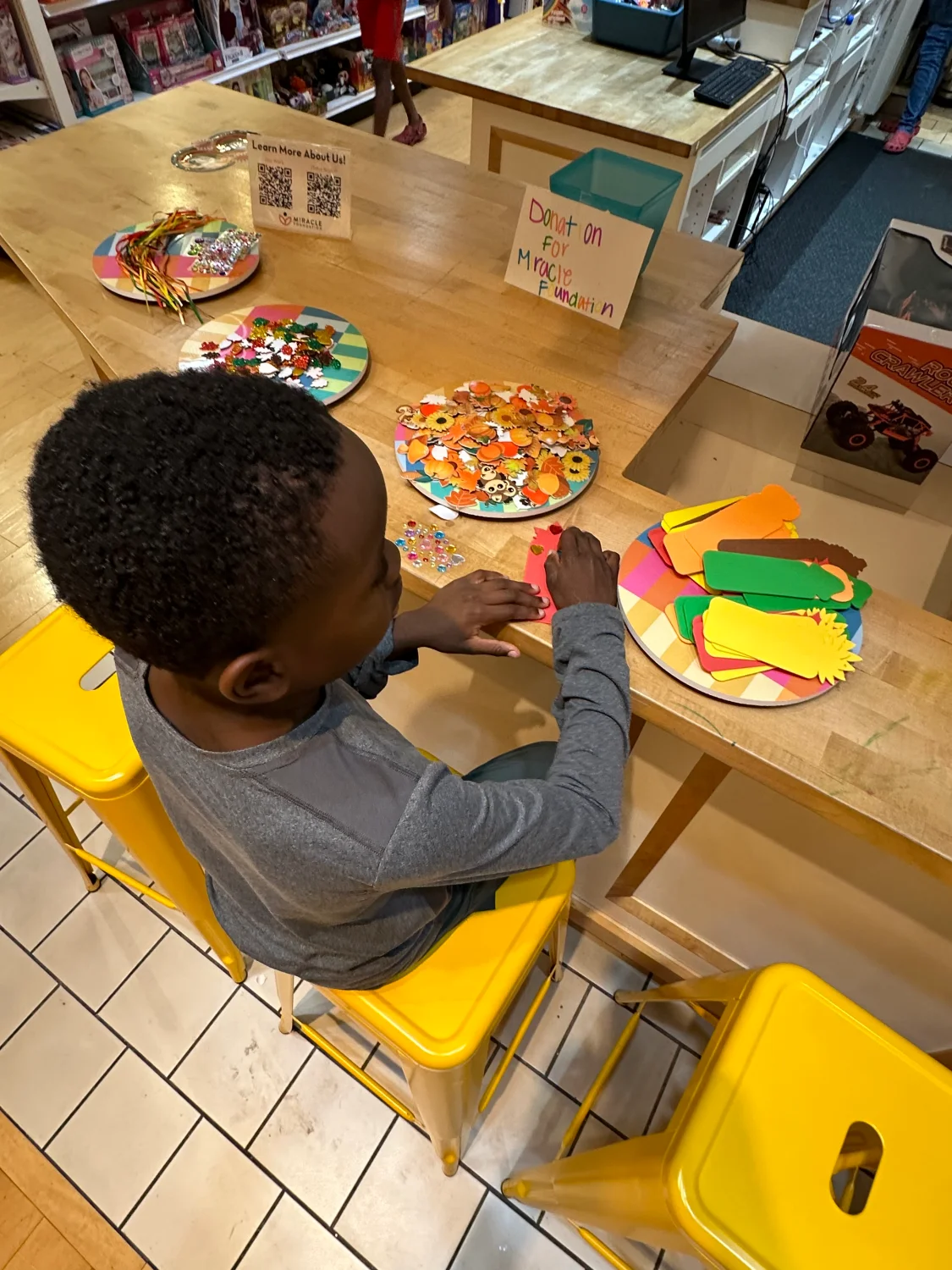 Child doing an art activity at Wonder World
