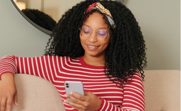 Person wearing classic style glasses with thin metal frames