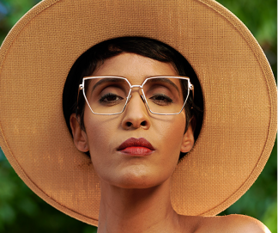 Person wearing classic style glasses with thin metal frames