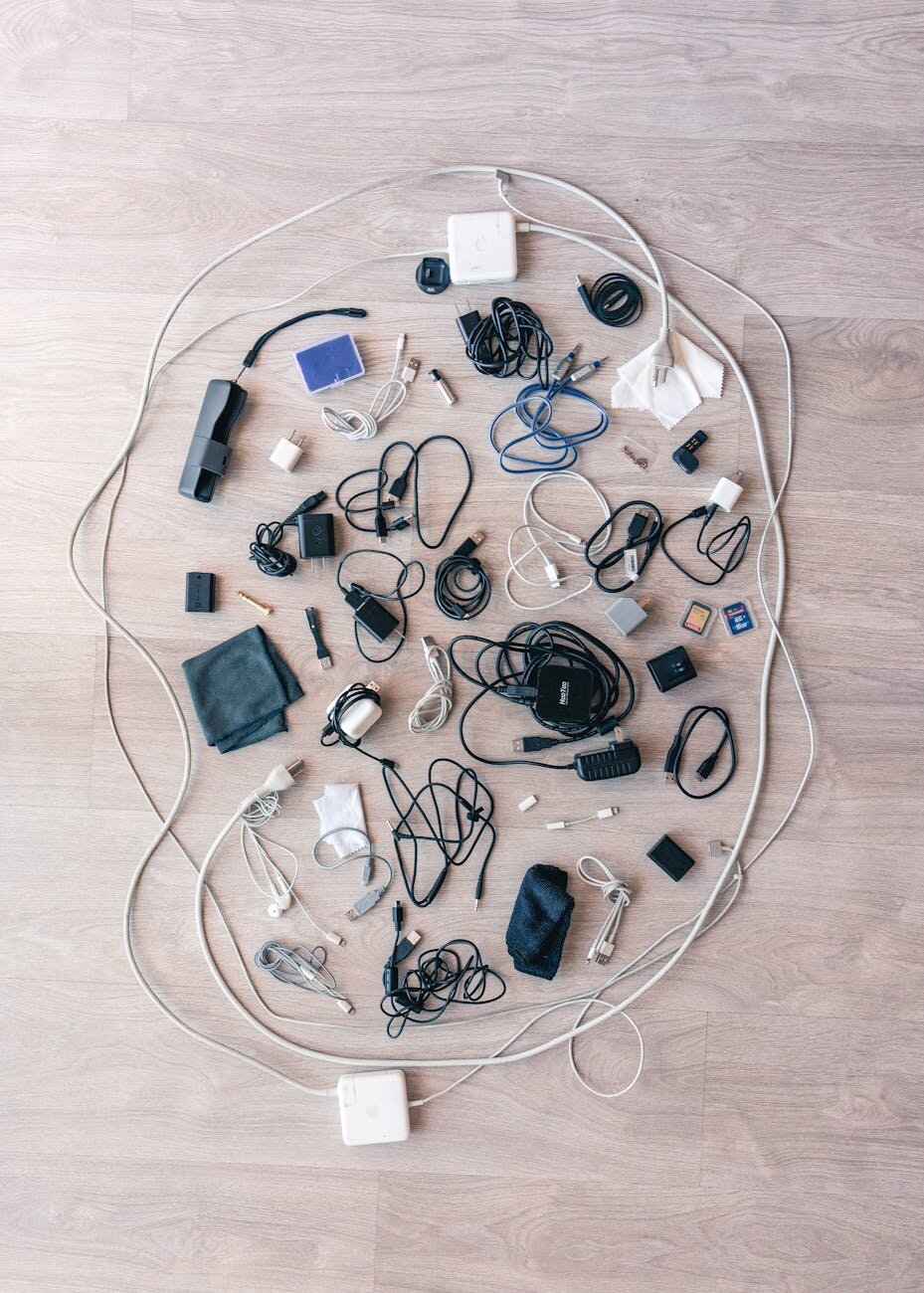 Cables and chargers on a wooden floor