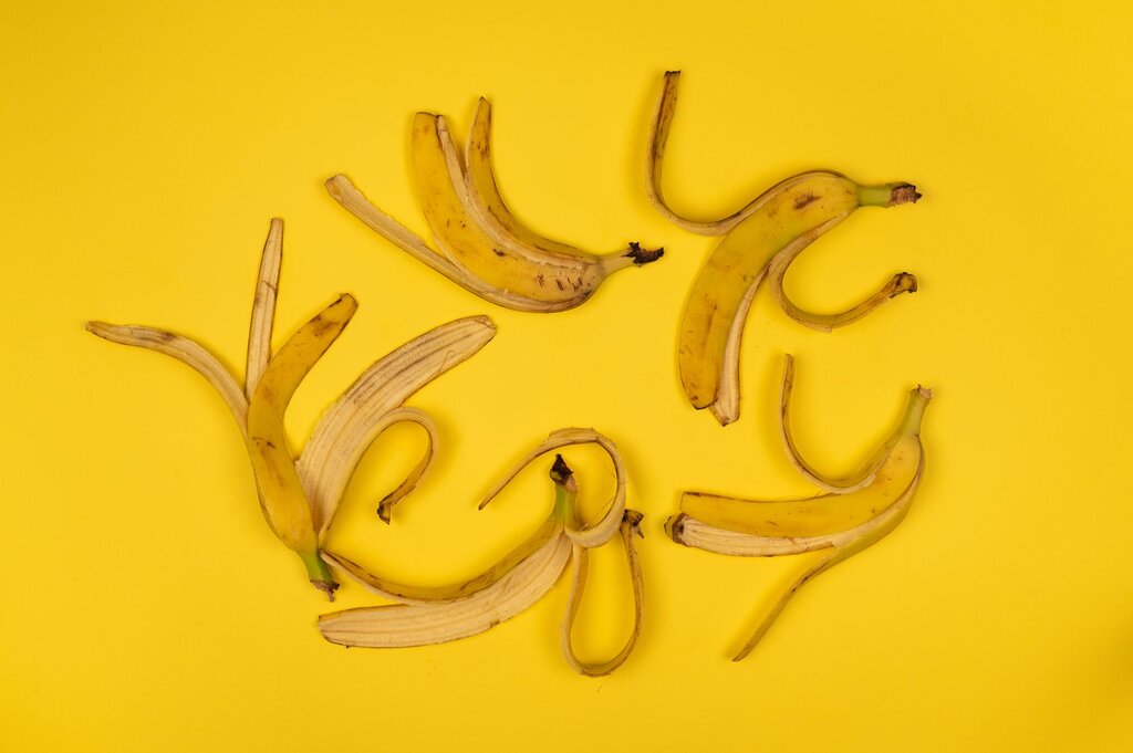 banana peels on yellow background