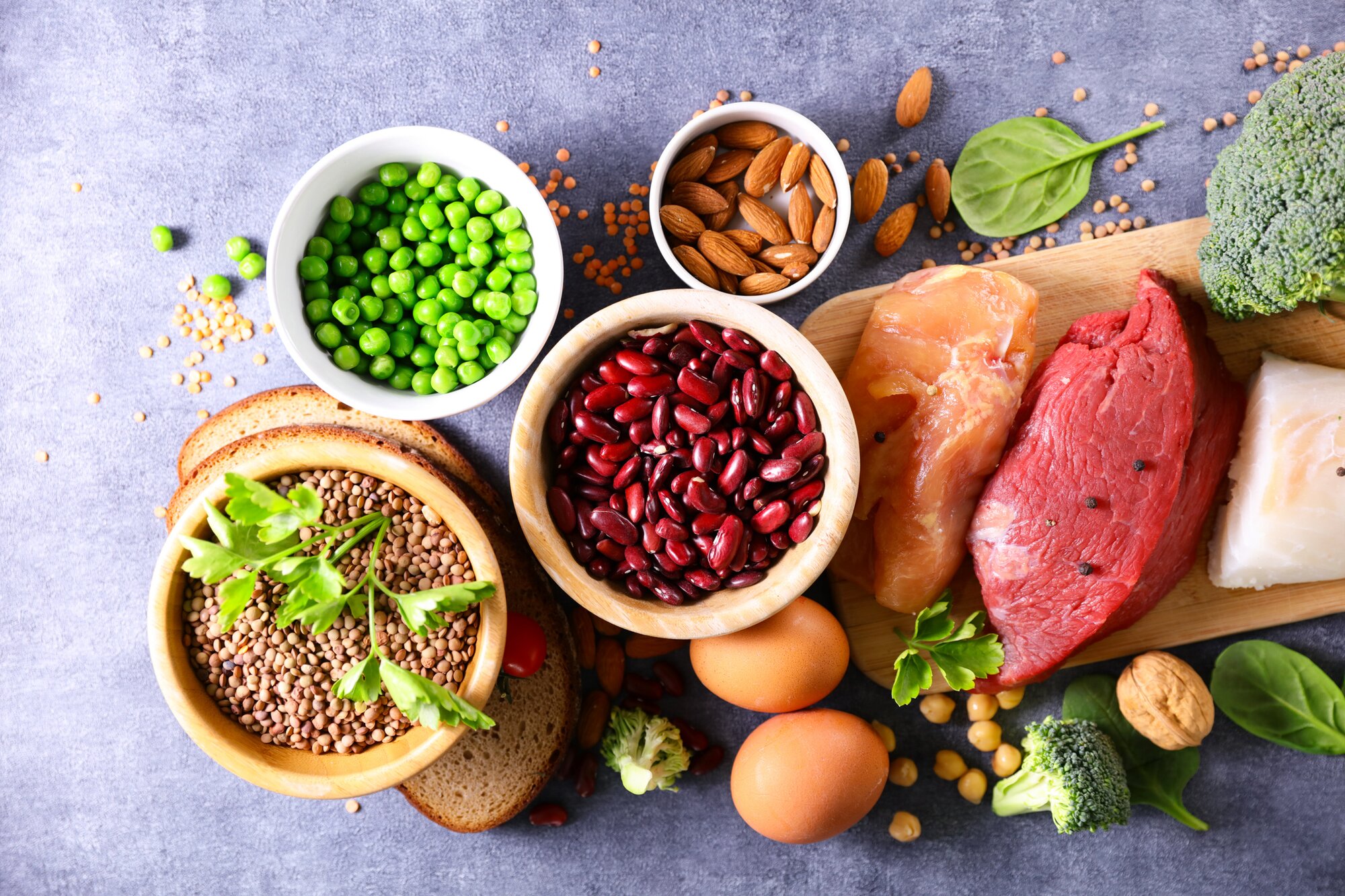 raw protein sources including legumes, nuts, eggs and meat