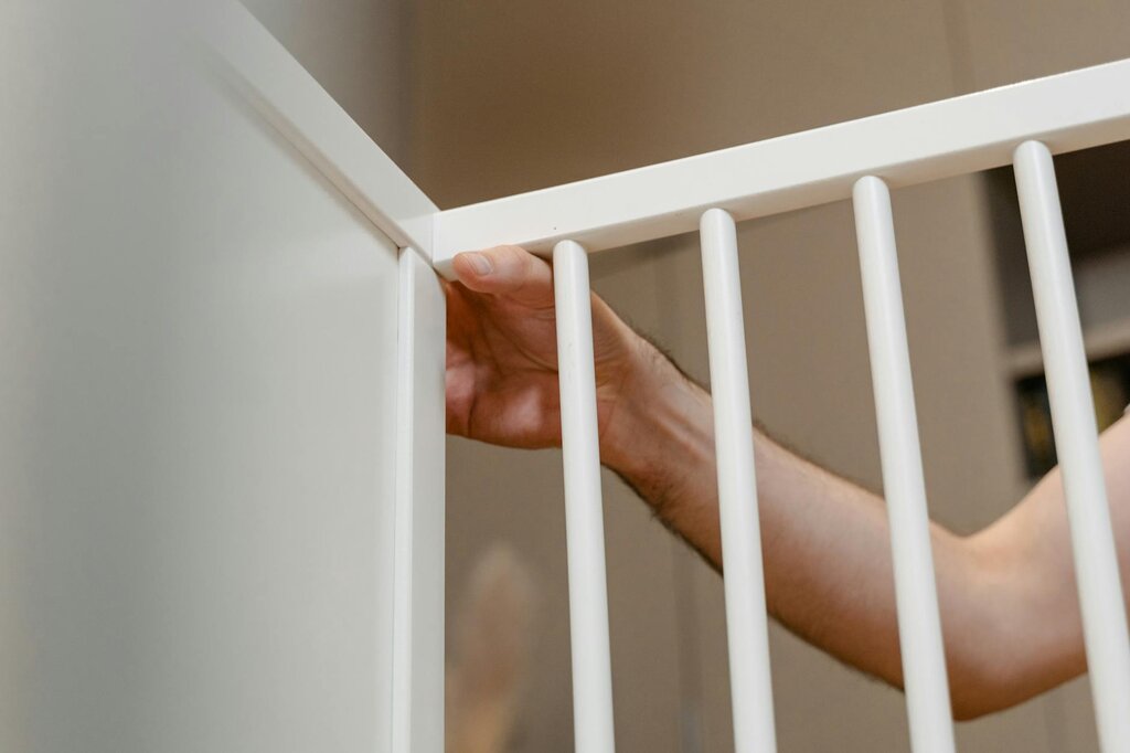 person installing baby gate