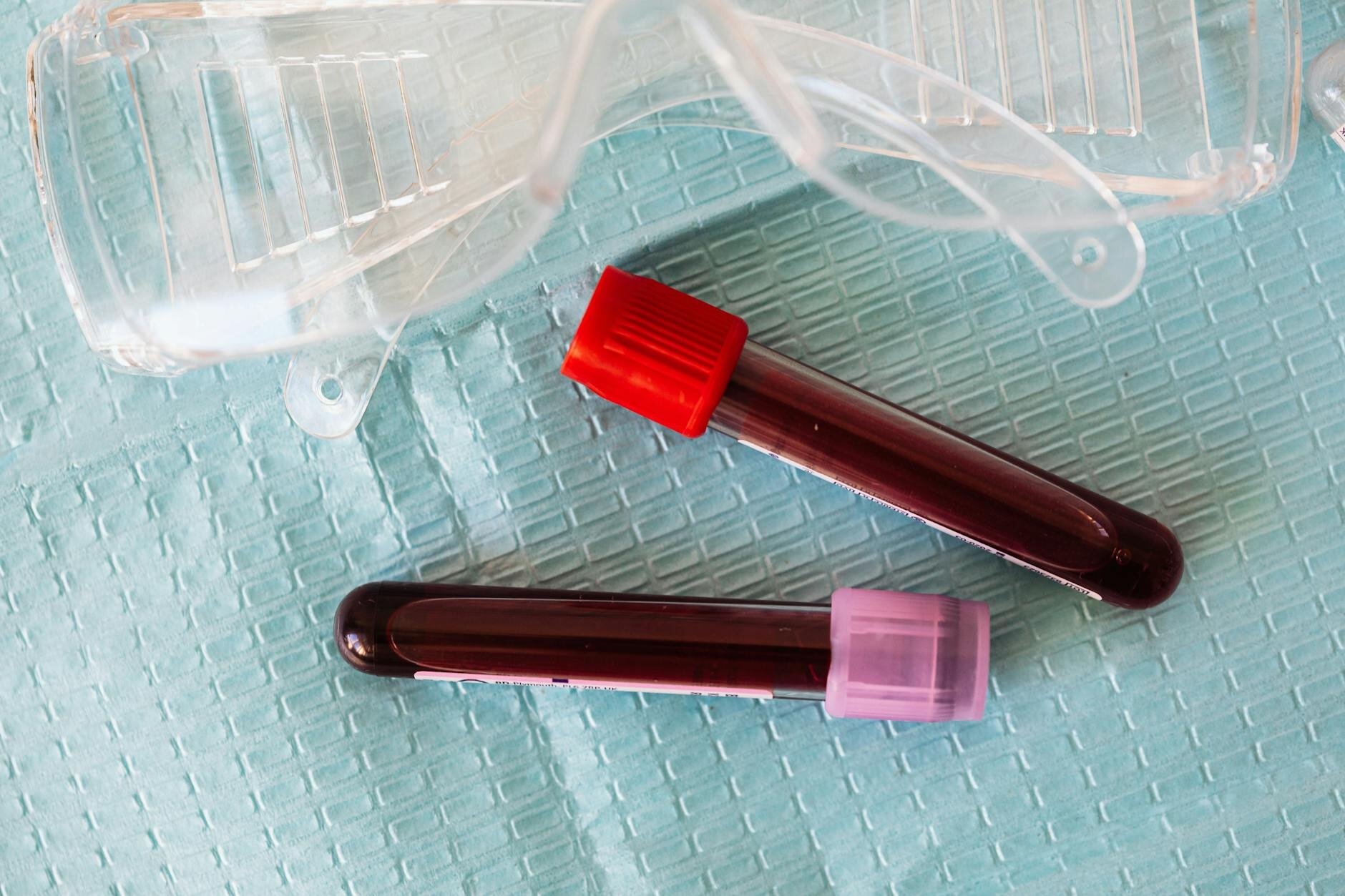 2 blood tubes and safety goggles