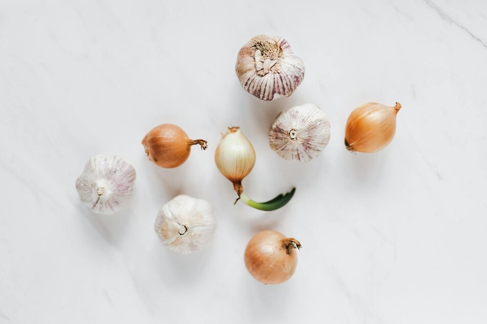 onions and garlic on white background