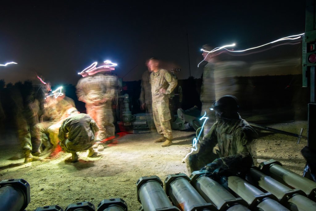  Staff Sergeant Madrid oversees his soldiers as they prepare their weapon.