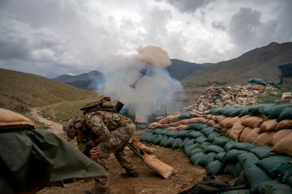 An American Special Forces NCO launches a 120mm mortar round during a fire mission in eastern Afghanistan. Photo by Marty Skovlund Jr./Coffee or Die Magazine.