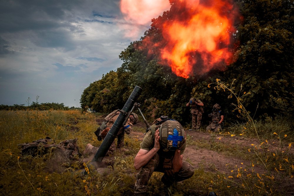 Ukrainian soldiers fire towards Russian positions on the frontline in Zaporizhzhia region.