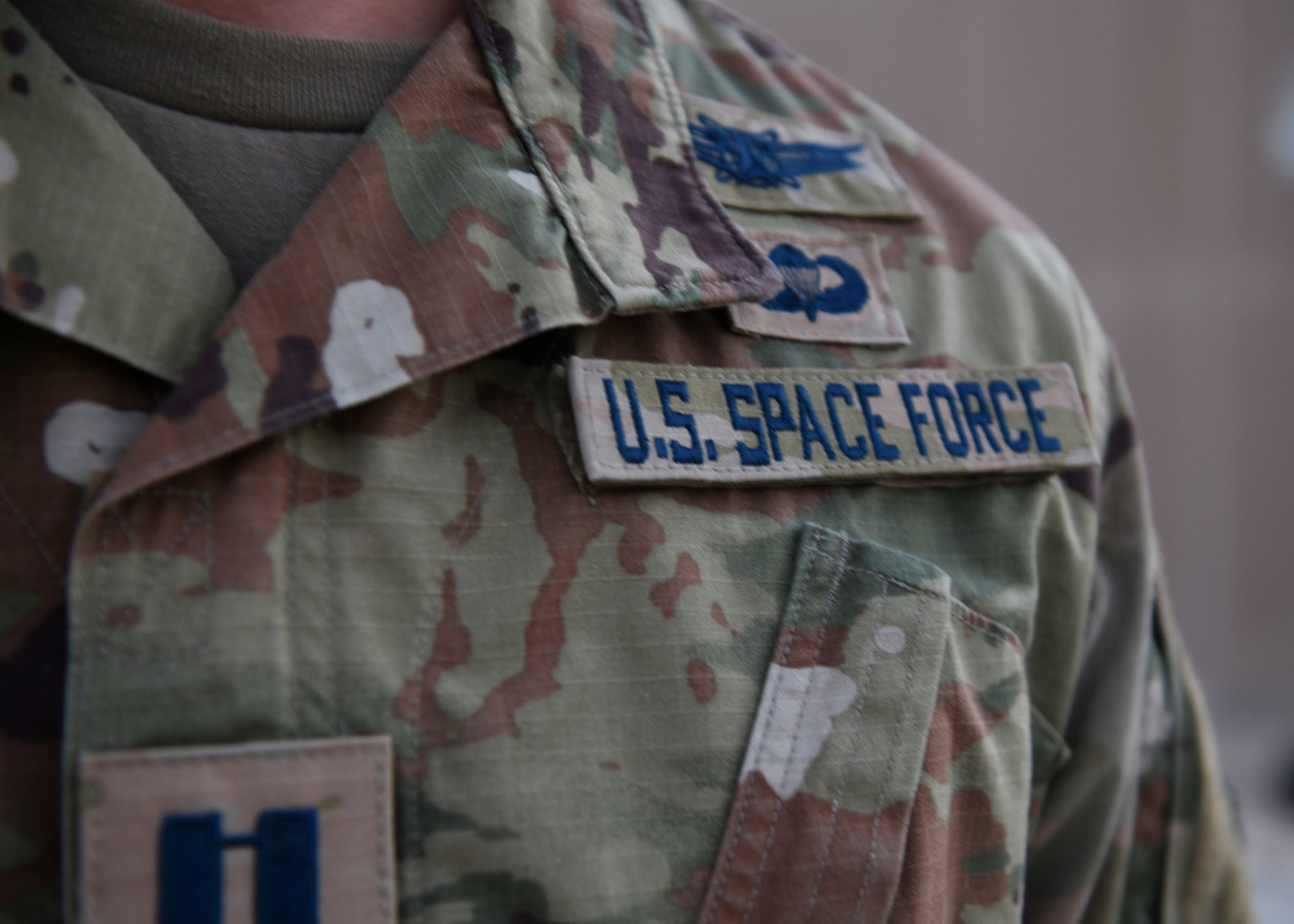 Capt. Ryan Vickers stands for a photo to display his new service tapes after taking his oath of office to transfer from the U.S. Air Force to the U.S. Space Force on Sept. 1, 2020, at Al Udeid Air Base, Qatar. The Space Force is the United States’ newest service in more than 70 years. US Air Force photo by Staff Sgt. Kayla White.