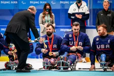 Medically retired Marine corporal Joseph “Joey” Woodke and his sled hockey teammates receive their gold medals at the 2022 Paralympic Winter Games in Beijing, China. Photo courtesy of Joey Woodke.