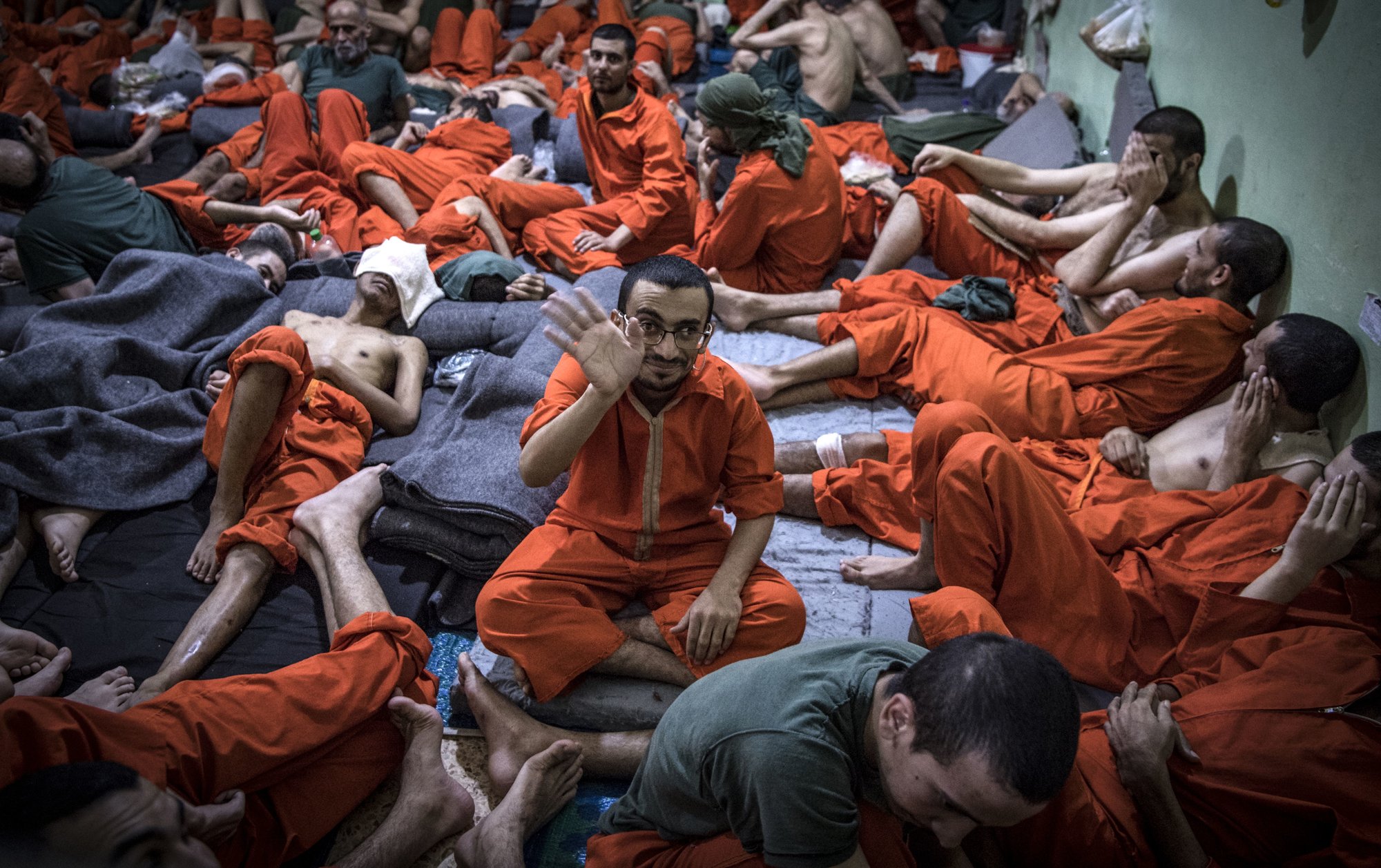 Men, suspected of being affiliated with the Islamic State group, gather in a prison cell in the northeastern Syrian city of Hasakeh on Oct. 26, 2019. On Nov. 30, 2022, a Connecticut man, Ahmad Khalil Elshazly, 25, pleaded guilty to attempting to provide support to Islamic State terrorists in late 2019. Photo by Fadel Senna/ AFP via Getty Images.