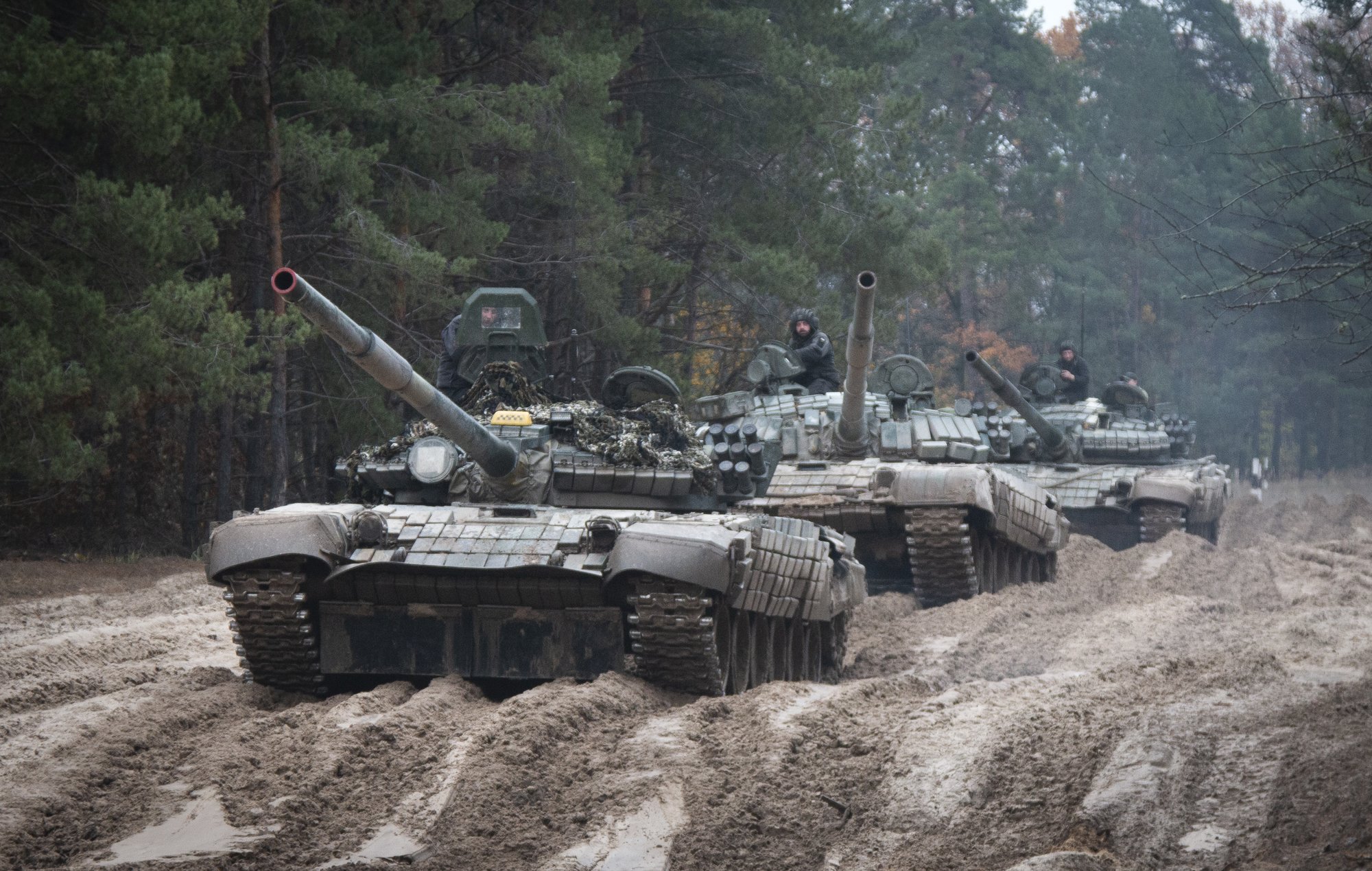 FILE - Ukrainian soldiers on captured Russian tanks T-72 hold military training close to the Ukraine-Belarus border near Chernihiv, Ukraine, Friday, Oct. 28, 2022. The West's move to send tanks to Ukraine was greeted enthusiastically from Kyiv, Berlin and Washington. But Moscow seemed to shrug. The Kremlin has warned the West that supplying tanks would be a dangerous escalation of the conflict and denounced the decision. AP photo by Aleksandr Shulman, File.