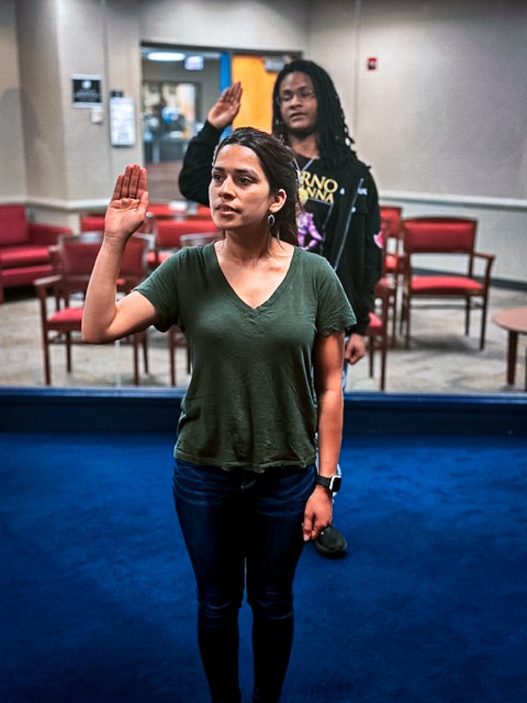 Esmita Spudes Bidari raises swears the oath to join the U.S. Army Reserves.