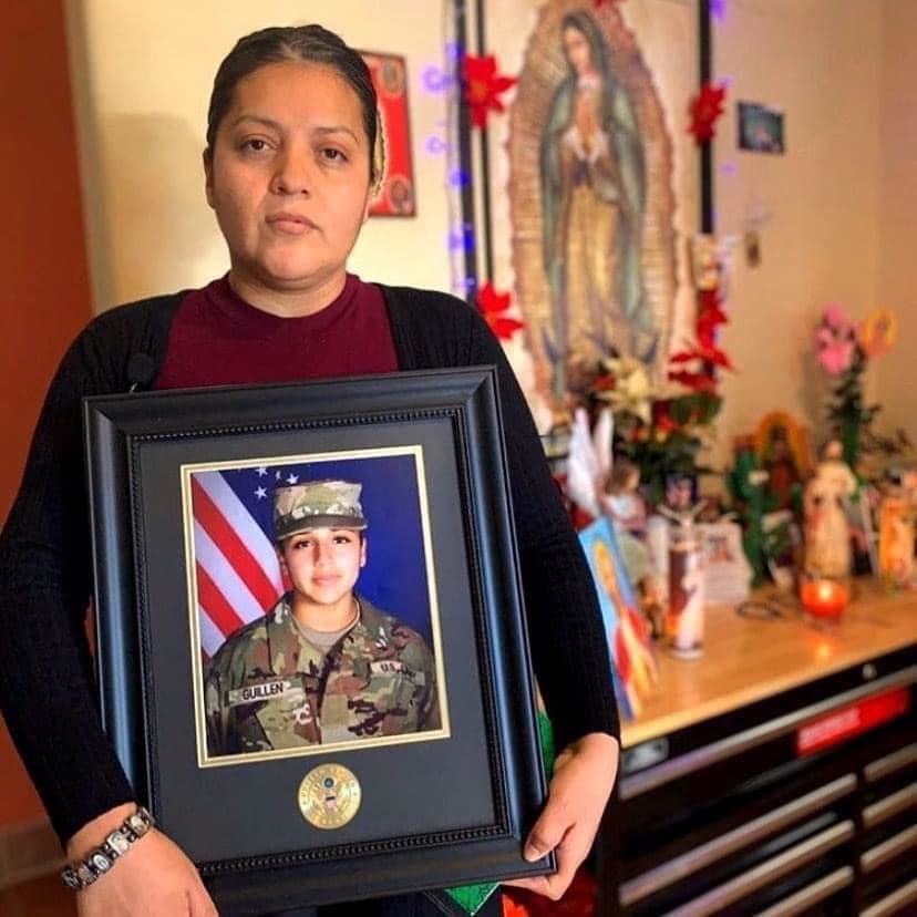 Vanessa Guillen's mother, Gloria, holding her daughter's Army photo. Photo courtesy of the Find Vanessa Guillen Facebook page.