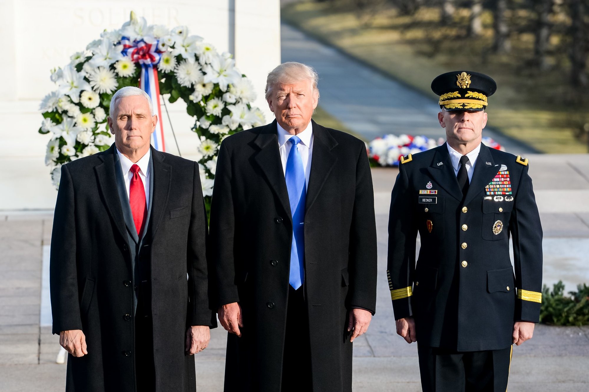 From the left, Vice President-elect Mike Pence, President-elect Donald J. Trump and Maj. Gen. Bradley A. Becker, Commanding General, Joint Task Force-National Capital Region and the U.S. Army Military District of Washington pause following a wreath-laying ceremony at the Tomb of the Unknown Soldier in Arlington National Cemetery, Jan. 19, 2017, in Arlington, Va. Trump will be sworn-in as the 45th president of the United States during the Inauguration Ceremony Jan. 20, 2017, in Washington, D.C.  (U.S. Army photo by Sgt. Alicia Brand/released)