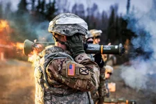 Army Staff Sgt. David Riley covers his ears while observing M136E1 AT4-CS light anti-armor rocket launcher live-fire training at Joint Base Elmendorf-Richardson, Alaska, Oct. 12, 2017. 3M, on Tuesday, Aug. 29, 2023, has agreed to pay $6 billion to settle numerous lawsuits from U.S. service members who say they experienced hearing loss or other serious injuries from using earplugs made by the company. US Air Force photo by Alejandro Pena.