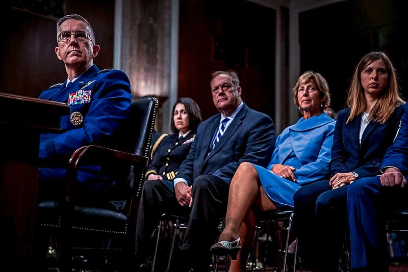 Gen. John Hyten, left, accompanied by members of his family, including his wife Laura, second from right, and his daughter Katie, right, appears before the Senate Armed Services Committee on Capitol Hill.