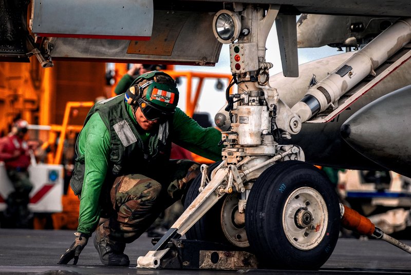 Green shirts aircraft carrier, aircrew colored shirts