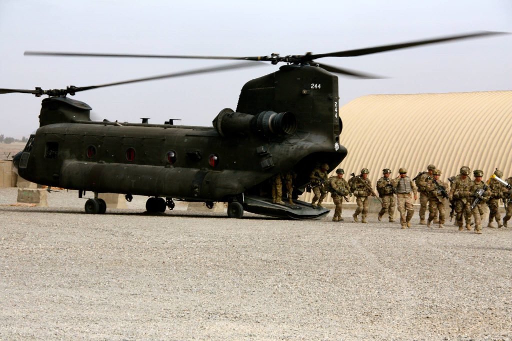 U.S. Army soldiers unload at a forward operating base in Afghanistan in 2013. Photo by Nolan Peterson/Coffee or Die.
