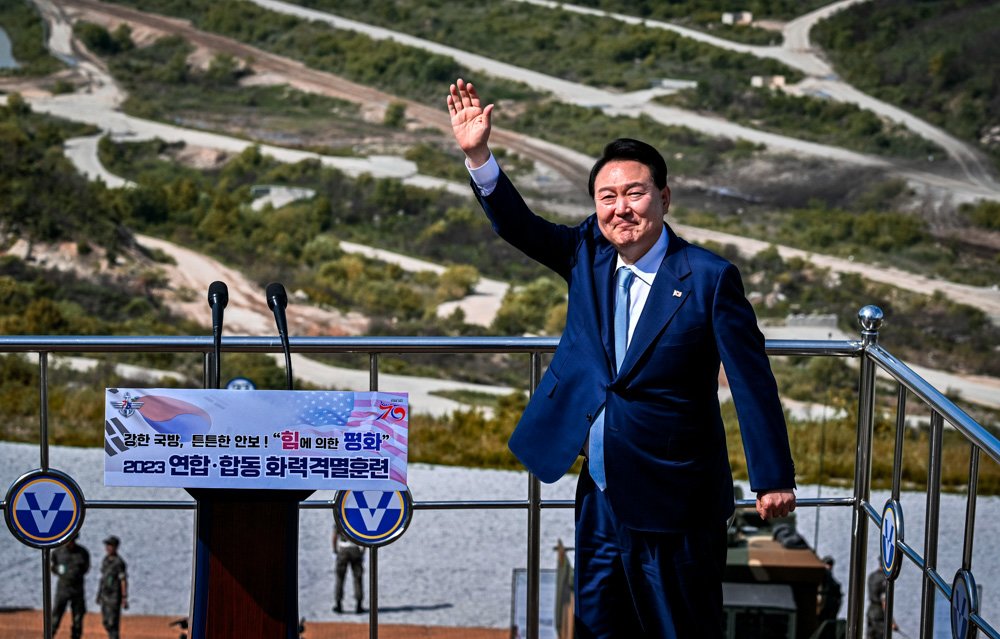 South Korean President Yoon Suk Yeol waves as he delivers a speech after a South Korea-U.S. joint military drill.