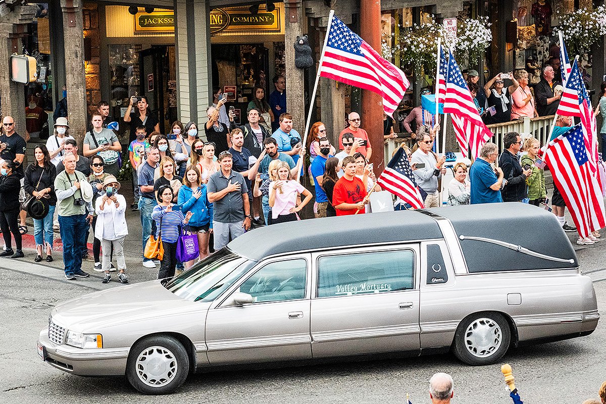 The hearse carrying Marine Cpl. Rylee McCollum passes the center of Jackson, Sept. 10. The procession carrying McCollum took more than 5 minutes to pass by, much like those seen around the country as fallen service members are returned home from the final days in Kabul, Afghanistan. Thousands lined the roads in and out of town. Photo by
Daryl Hunter (daryl-hunter.com).