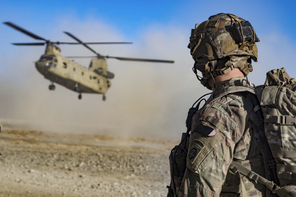 U.S. Army Staff Sgt. Jason N. Bobo, assigned with C Troop, 5th Squadron, 73rd Cavalry Regiment, 3rd Brigade Combat Team, 82nd Airborne Division watches as a CH-47 Chinook helicopter prepares to land in preparation for the extraction (EXFIL) of Afghan and U.S. Soldiers following a key leader engagement Dec. 29 in Southeastern Afghanistan. Photo by Army Master Sgt. Alejandro Licea, courtesy of the Department of Defense.