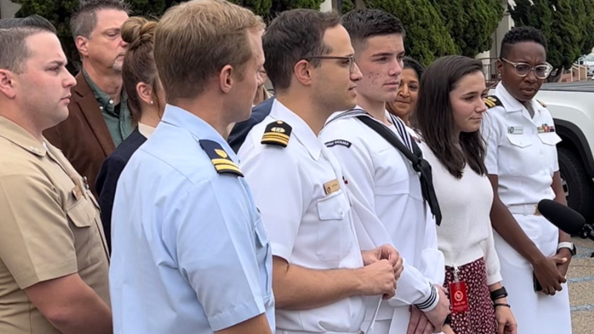 Flanked by his legal team and loved ones, US Navy Seaman Recruit Ryan Mays, center, greets reporters at Naval Base San Diego on Sept. 30, 2022. Mays, 21, was found not guilty of torching the amphibious warship Bonhomme Richard in 2020. Photo by Tom Wyatt/Coffee or Die Magazine.