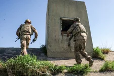 American soldiers inspect a bunker during a perimeter patrol around K1. Photo by Kevin Knodell/Coffee or Die.