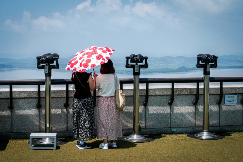 Visitors watch the North Korea side from the Unification Observation Post in Paju, South Korea.